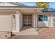 Inviting front entrance with secure metal gate, showcasing a well-kept exterior, and a glimpse of natural light at 8212 Ducharme Ave, Las Vegas, NV 89145