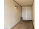 Cozy front porch featuring decorative wall texture, secure gate, and a welcoming mat adding a personal touch at 8212 Ducharme Ave, Las Vegas, NV 89145