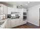 Well-lit kitchen with stainless steel appliances and views of the backyard at 8212 Ducharme Ave, Las Vegas, NV 89145