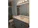 The renovated bathroom features a modern vanity and a glass enclosed shower at 8455 W Sahara Ave # 258, Las Vegas, NV 89117