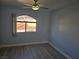 Bedroom with wood-look floors and a window at 8455 W Sahara Ave # 258, Las Vegas, NV 89117