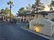 Well-maintained community entrance with mature trees and manicured landscaping at 8455 W Sahara Ave # 258, Las Vegas, NV 89117