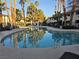 Community pool with view of community buildings behind provides a relaxing and social area for residents at 8455 W Sahara Ave # 258, Las Vegas, NV 89117