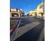 Street view within the community shows carports, red tile roofs, and attractive landscaping at 8455 W Sahara Ave # 258, Las Vegas, NV 89117