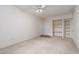 Spacious living room with neutral carpet, ceiling fan, and built-in shelving at 9000 Las Vegas Blvd # 1245, Las Vegas, NV 89123