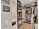 Walk-in closet with custom shelves, cabinets, and a bench at 9000 Las Vegas Blvd # 2138, Las Vegas, NV 89123