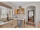 Well-lit kitchen features stainless steel appliances, a double sink, and marble-patterned countertops at 9000 Las Vegas Blvd # 2138, Las Vegas, NV 89123