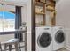 Efficient laundry room featuring side-by-side washer and dryer and built in storage at 9000 Las Vegas Blvd # 2138, Las Vegas, NV 89123