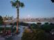 Desert backyard featuring a trampoline, landscaping, and pool, as well as evening views at 9012 Alpine Peaks Ave, Las Vegas, NV 89147