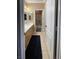 Well-lit bathroom featuring a vanity, mirror, and tile flooring at 9012 Alpine Peaks Ave, Las Vegas, NV 89147