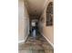 Hallway with tile flooring and archway leading to the living room at 9012 Alpine Peaks Ave, Las Vegas, NV 89147