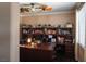 This home office features a built in bookcase and wrap around desk with lots of workspace at 9012 Alpine Peaks Ave, Las Vegas, NV 89147