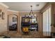 Cozy living room features a large sectional couch and a ceiling fan, viewed from the kitchen counter at 9012 Alpine Peaks Ave, Las Vegas, NV 89147