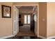 View into a living room with fireplace and patio access at 9012 Alpine Peaks Ave, Las Vegas, NV 89147