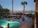 Inviting backyard pool and spa area with lounge chairs, a trampoline, and desert landscaping at 9012 Alpine Peaks Ave, Las Vegas, NV 89147