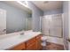 Bathroom featuring a wood vanity, sink, shower and toilet at 9144 Epworth Ave, Las Vegas, NV 89148