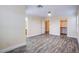 Spacious bedroom featuring wood-look flooring, neutral walls, ceiling fan and walk-in closet at 9144 Epworth Ave, Las Vegas, NV 89148