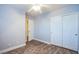 Bedroom with wood-look flooring, neutral walls, closet with sliding doors, and ceiling fan at 9144 Epworth Ave, Las Vegas, NV 89148