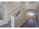 Foyer with decorative staircase, modern floors, and neutral color palette at 9144 Epworth Ave, Las Vegas, NV 89148