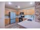 Well-lit kitchen showcasing wooden cabinets, modern appliances, and stylish countertops at 9144 Epworth Ave, Las Vegas, NV 89148