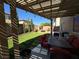 Inviting backyard patio with a pergola, outdoor seating, and manicured lawn at 9364 Olympia Falls Ave, Las Vegas, NV 89149