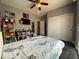 Comfortable bedroom with a ceiling fan and a closet, decorated with anime items at 9364 Olympia Falls Ave, Las Vegas, NV 89149