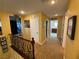 Upstairs hallway with views of the theater and laundry room for added convenience at 9364 Olympia Falls Ave, Las Vegas, NV 89149