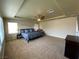 Carpeted main bedroom features a ceiling fan, large windows and natural light at 9364 Olympia Falls Ave, Las Vegas, NV 89149