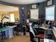 Inviting home office space with windows, custom decor, and a gamer chair at 9364 Olympia Falls Ave, Las Vegas, NV 89149