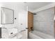 Contemporary bathroom with a soaking tub, wood paneling, and a modern sink at 9795 La Cienega St, Las Vegas, NV 89183