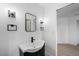 Modern bathroom featuring a sink with black hardware and decorative lighting at 9795 La Cienega St, Las Vegas, NV 89183