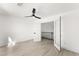 Bright room with white french doors, ceiling fan, and view of the house's black railing at 9795 La Cienega St, Las Vegas, NV 89183