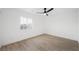 Bright bedroom with natural light, light hardwood floors and a ceiling fan at 9795 La Cienega St, Las Vegas, NV 89183