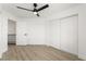 Bright bedroom featuring a ceiling fan, closet, and light hardwood floors at 9795 La Cienega St, Las Vegas, NV 89183