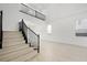 Entryway with wood floors, staircase, and views to the second story at 9795 La Cienega St, Las Vegas, NV 89183