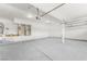 Spacious garage featuring concrete flooring, recessed lighting, and mechanical equipment at 9795 La Cienega St, Las Vegas, NV 89183