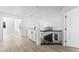 Bright hallway features light wood floors and a modern black and white staircase at 9795 La Cienega St, Las Vegas, NV 89183