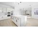 Bright, modern kitchen with a large island, stylish pendant lighting, and stainless steel appliances at 9795 La Cienega St, Las Vegas, NV 89183