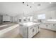 Open-concept kitchen featuring island, pendant lights, and a view of the living area at 9795 La Cienega St, Las Vegas, NV 89183