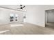 Bright living room features white walls, light wood floors and access to the balcony at 9795 La Cienega St, Las Vegas, NV 89183