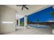 View of the in-ground pool area from the covered patio, including palm trees and desert landscaping at 9795 La Cienega St, Las Vegas, NV 89183