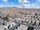 Aerial view of residential neighborhood, highlighting consistent architecture and Lone Mountain in background at 10651 Streamside Ave, Las Vegas, NV 89129