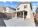 Exterior view of the house featuring a covered patio and concrete patio at 10651 Streamside Ave, Las Vegas, NV 89129