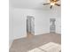 Carpeted primary bedroom featuring a ceiling fan and connecting doors to the Primary bath at 10651 Streamside Ave, Las Vegas, NV 89129