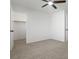 Bedroom featuring neutral carpeting, a ceiling fan, an closet at 10651 Streamside Ave, Las Vegas, NV 89129