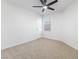 Bedroom featuring neutral carpeting, a ceiling fan, and a window providing natural light at 10651 Streamside Ave, Las Vegas, NV 89129