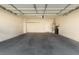 An attached two-car garage features overhead lighting and ample space at 10651 Streamside Ave, Las Vegas, NV 89129