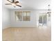 The living room offers a ceiling fan, tile floors and sliding glass doors to the backyard at 10651 Streamside Ave, Las Vegas, NV 89129