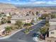 Street view of the Hillcrest community with palm trees, landscaping, and gated entrance at 10651 Streamside Ave, Las Vegas, NV 89129