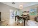 Bright dining area with sliding glass doors leading to the patio and backyard at 11165 Robin Park Ave, Las Vegas, NV 89138